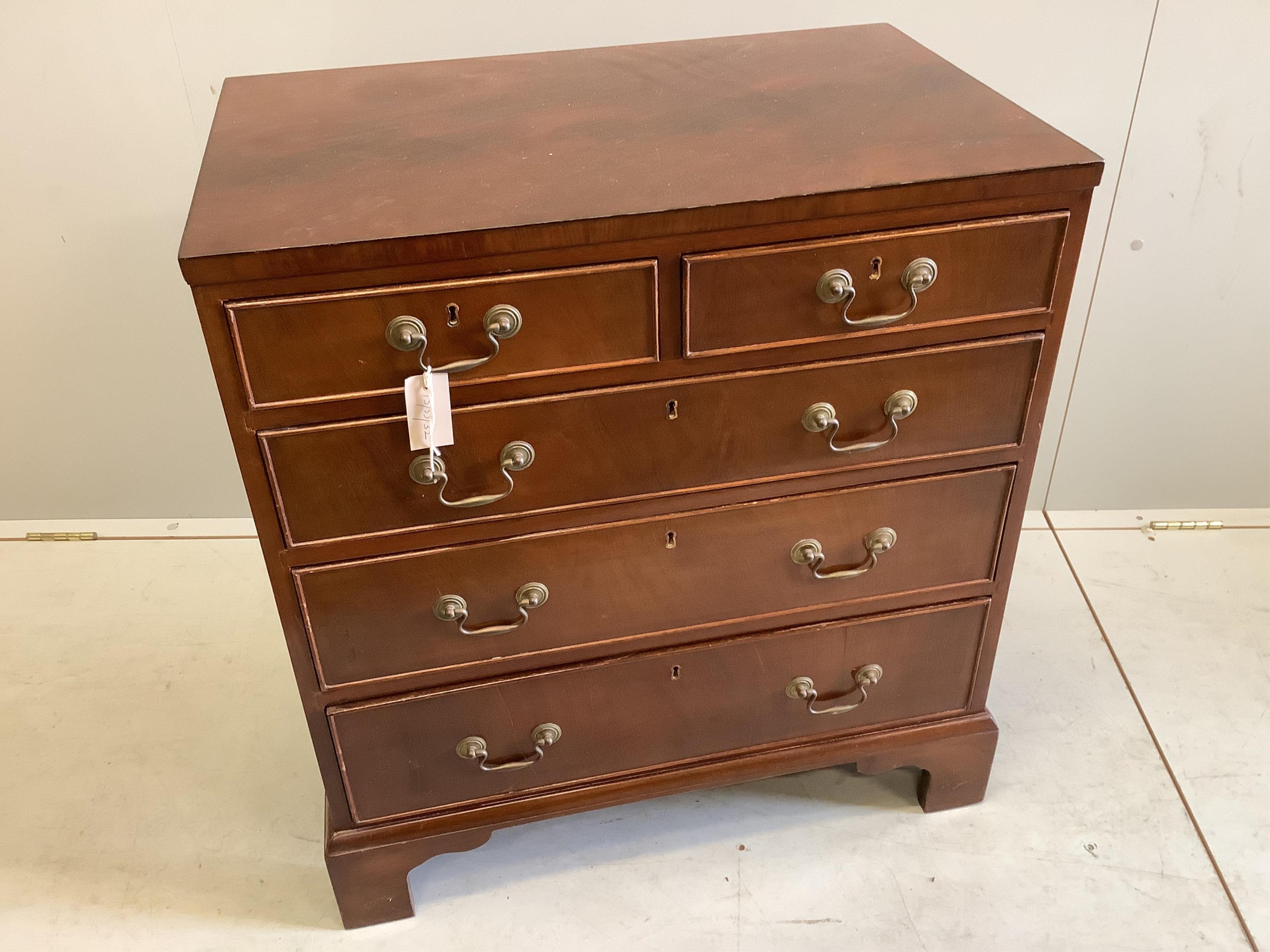 A Georgian style mahogany flush top chest fitted two short and three long drawers, on bracket feet, width 72cm, depth 46cm, height 78cm